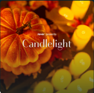 top of a pumpkin with several lit votive candles to the right. The words fever presents Candlelight in white is in the center