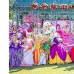 Several girls in rose festival costumes. The costumes are all colors